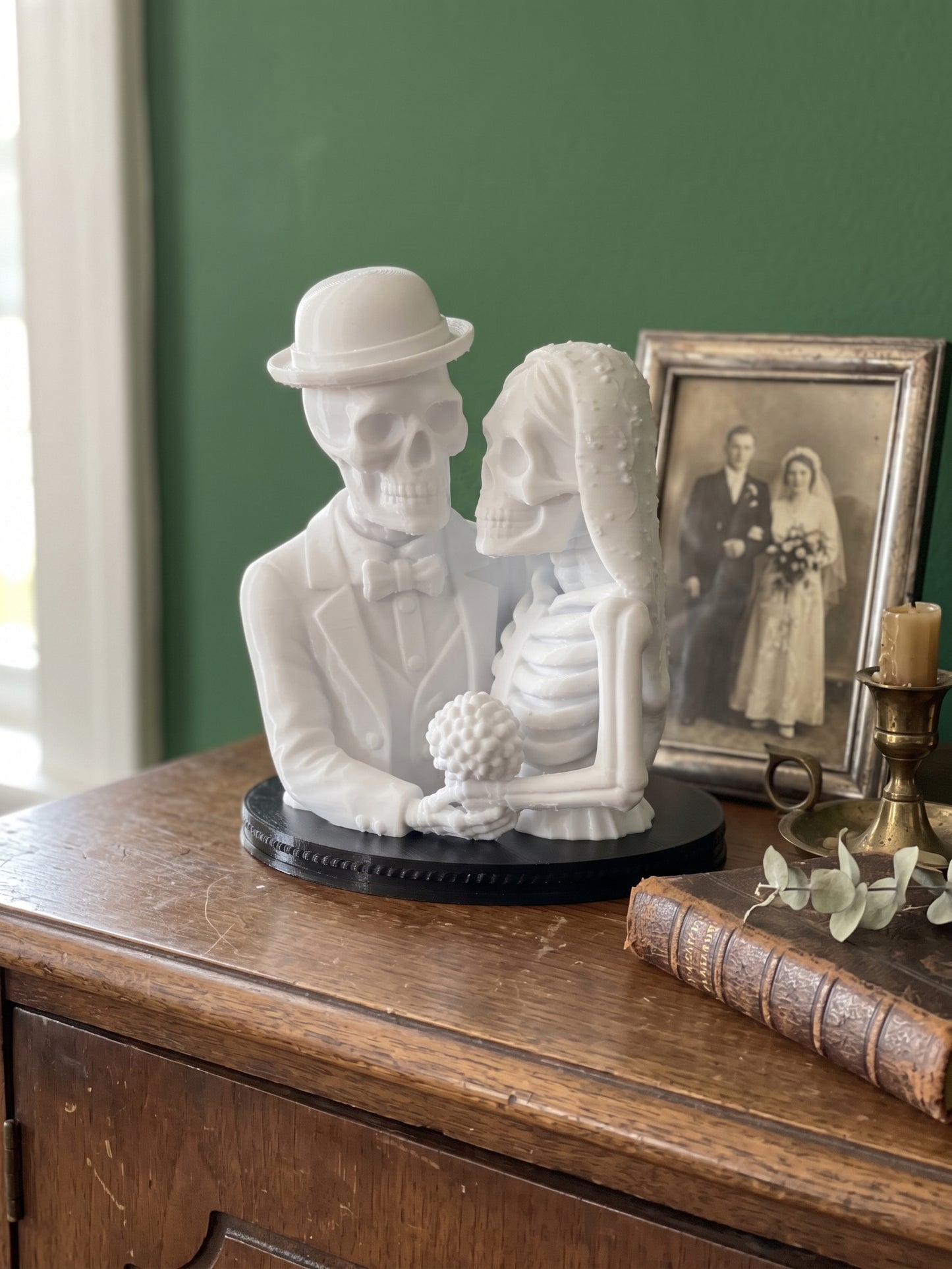 White skeleton couple Halloween decoration displayed with gothic home accessories