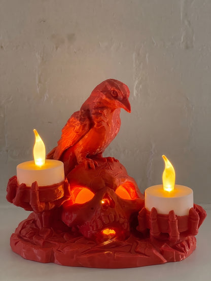 Red Halloween skull and raven candle holder with illuminated skull and three warm LED candles.